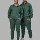 Duo wearing Unisex Fundamental 1/4 Zip Sweater - Dark Forest