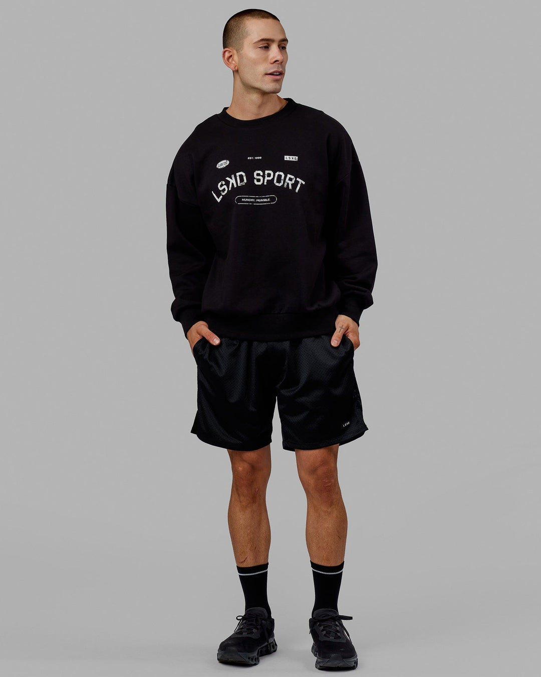 Man wearing Unisex Free Throw Sweater Oversize - Black