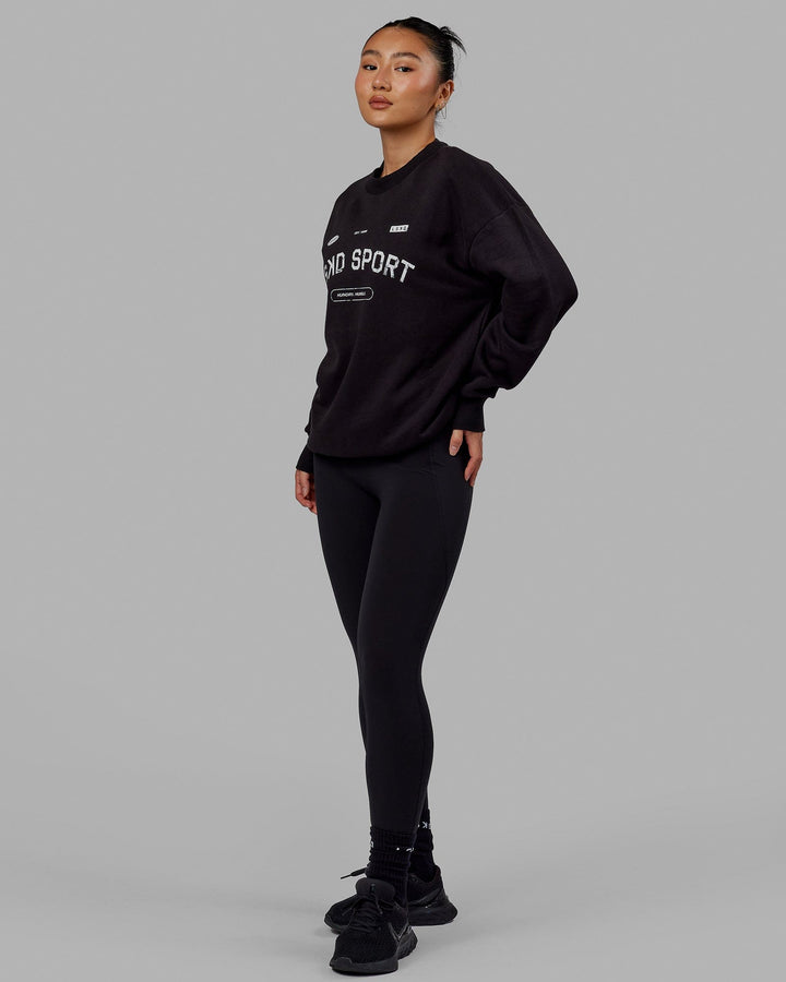 Woman wearing Unisex Free Throw Sweater Oversize - Black